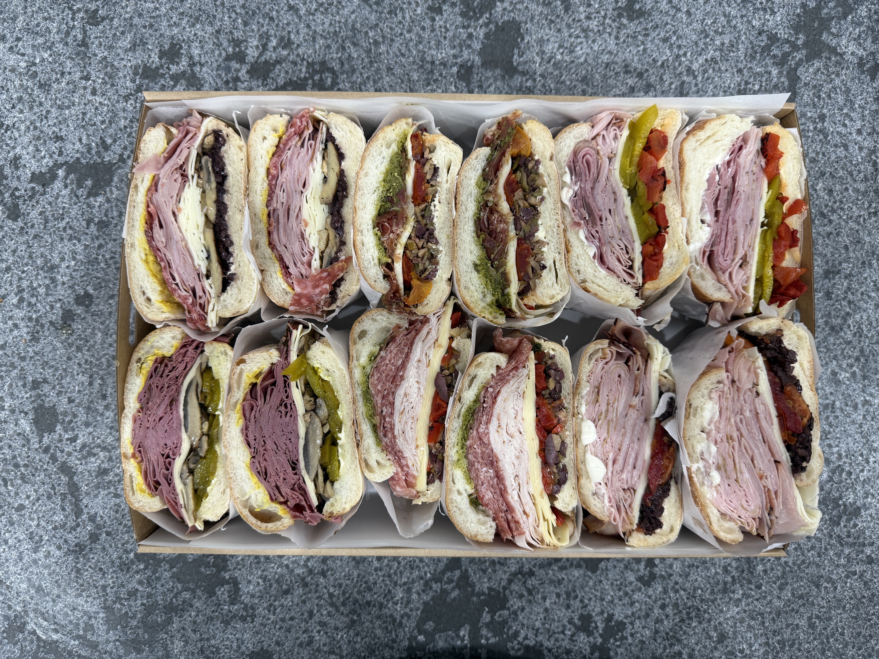 A tray of generously filled DeliCut sandwiches