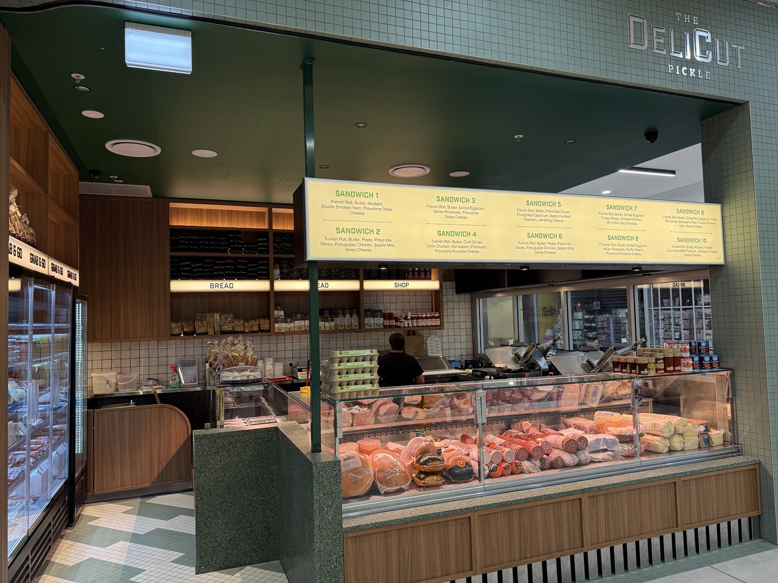 The DeliCut Pickle shop with sage tiles, fresh bread and a full deli counter