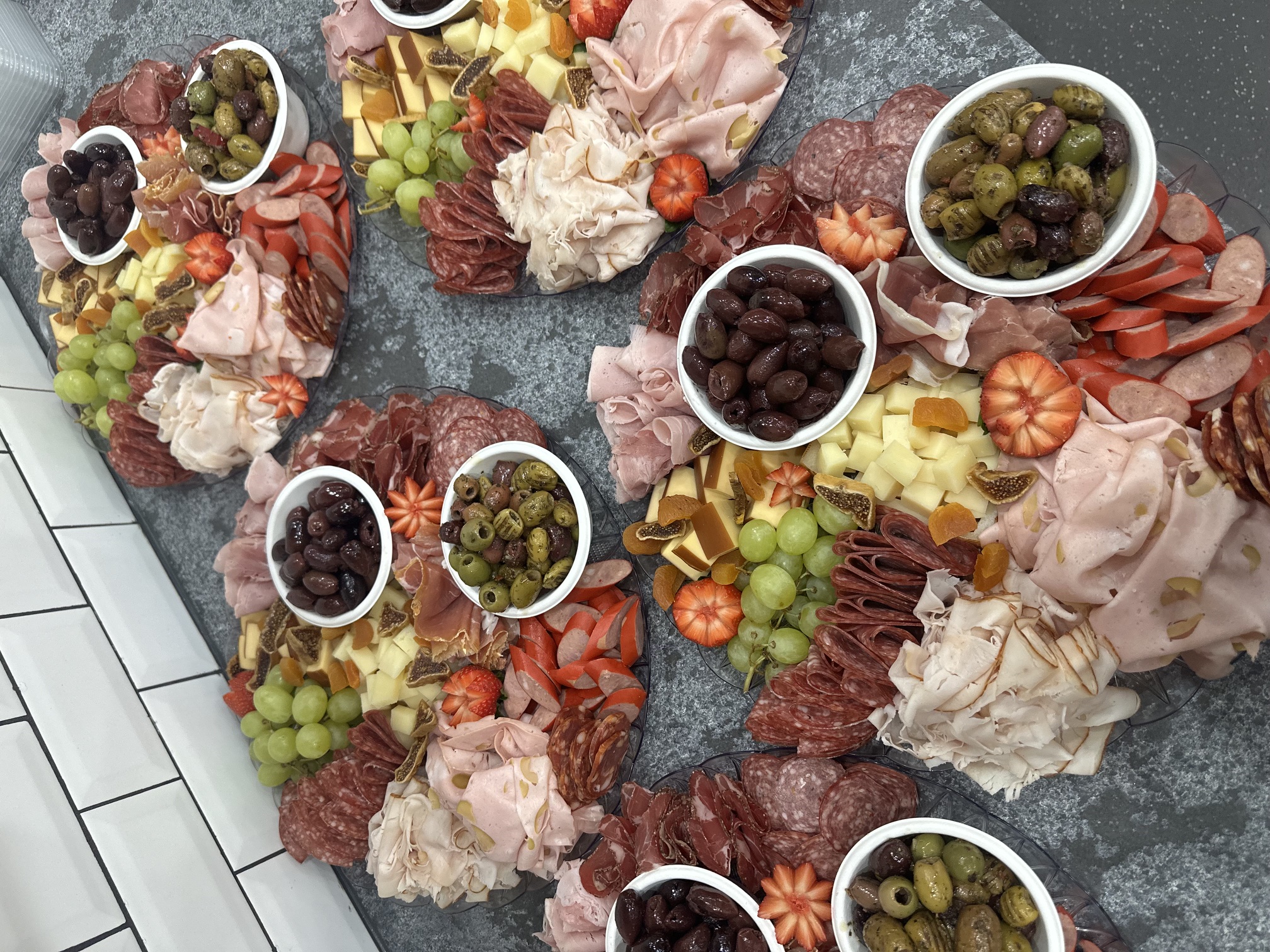 DeliCut catering platters with meats, cheeses, fruit and olives